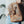 Load image into Gallery viewer, Woman carrying a leather bag with an air tag leather holder