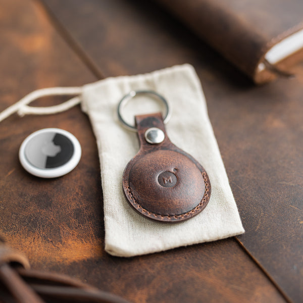 Leather air tag holder on a bag