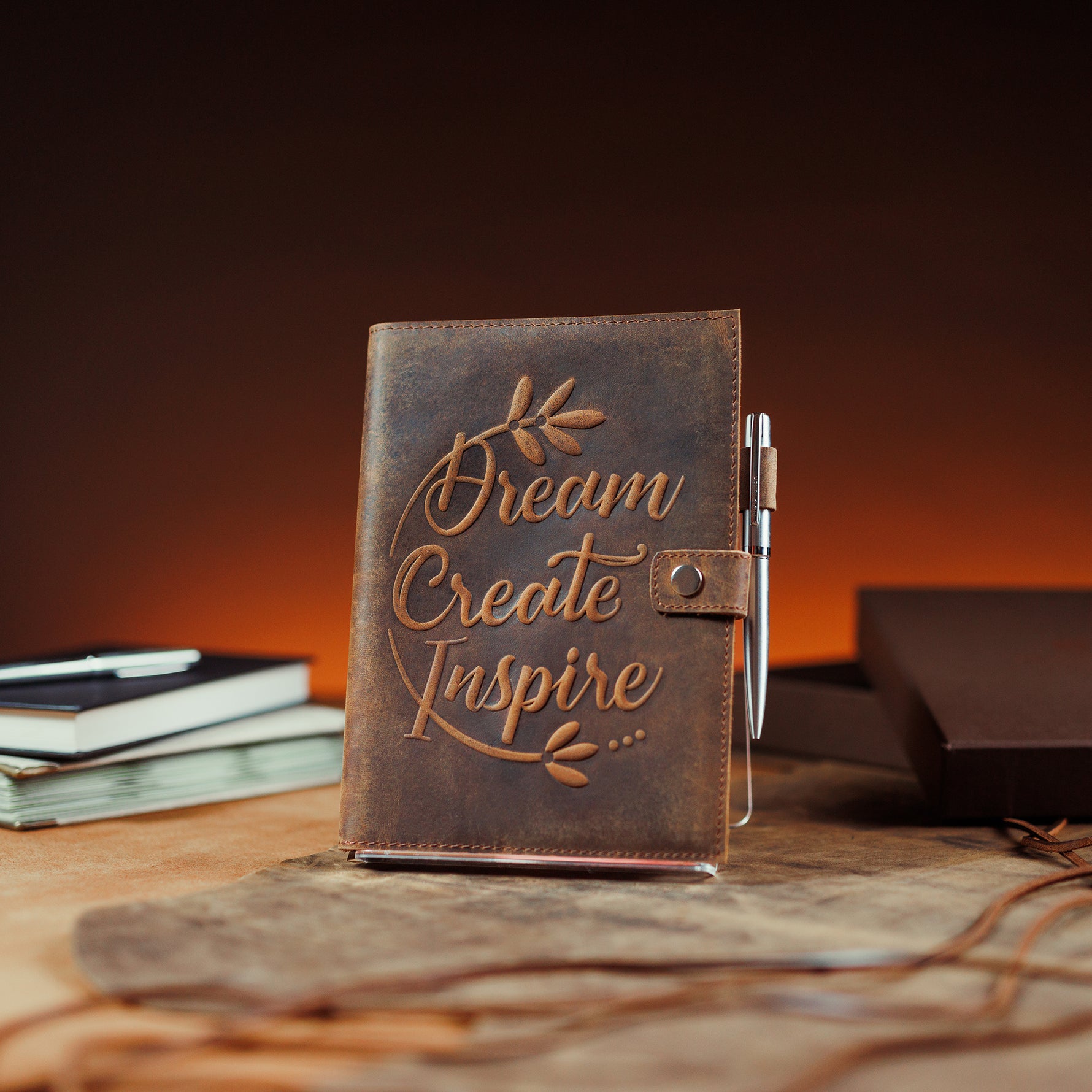 Dream Create Inspire leather journal by Moonster on display