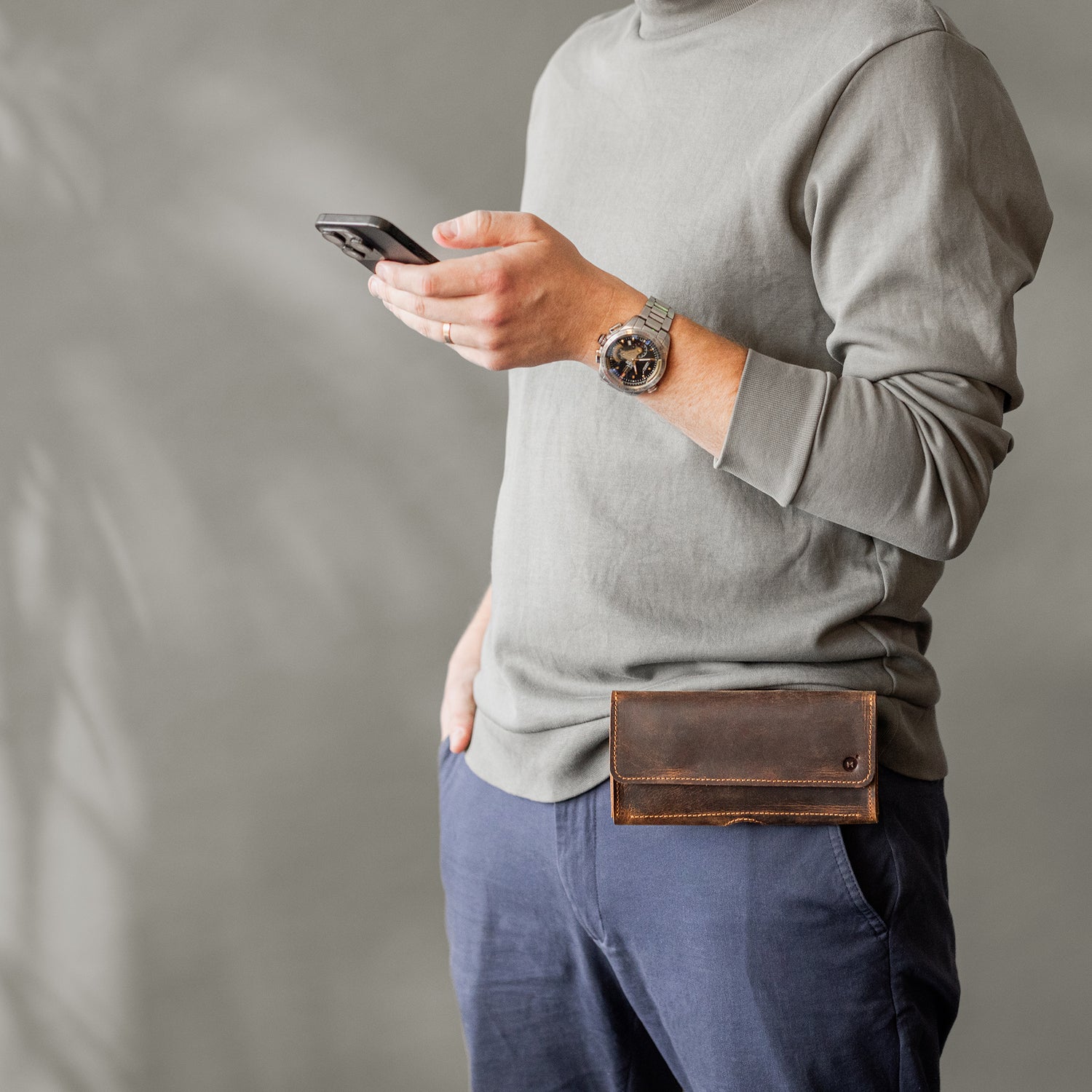 Man wearing a horizontal leather phone holster