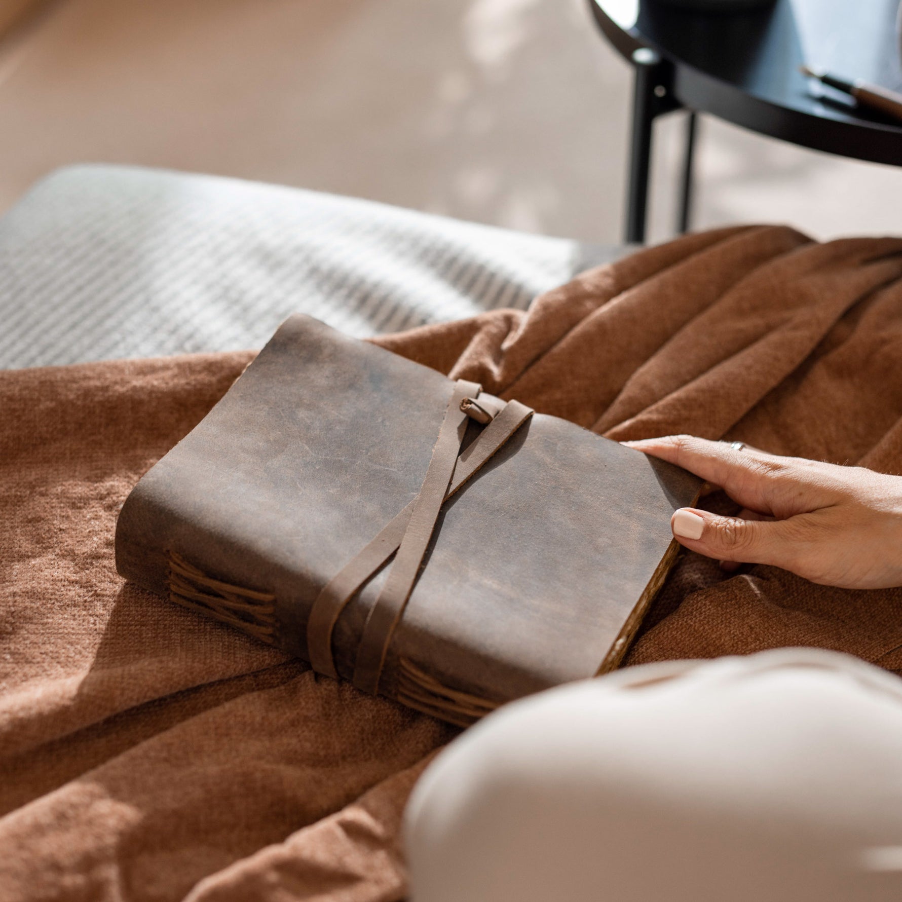 woman holding a Deckle Edge Vintage Leather Journal