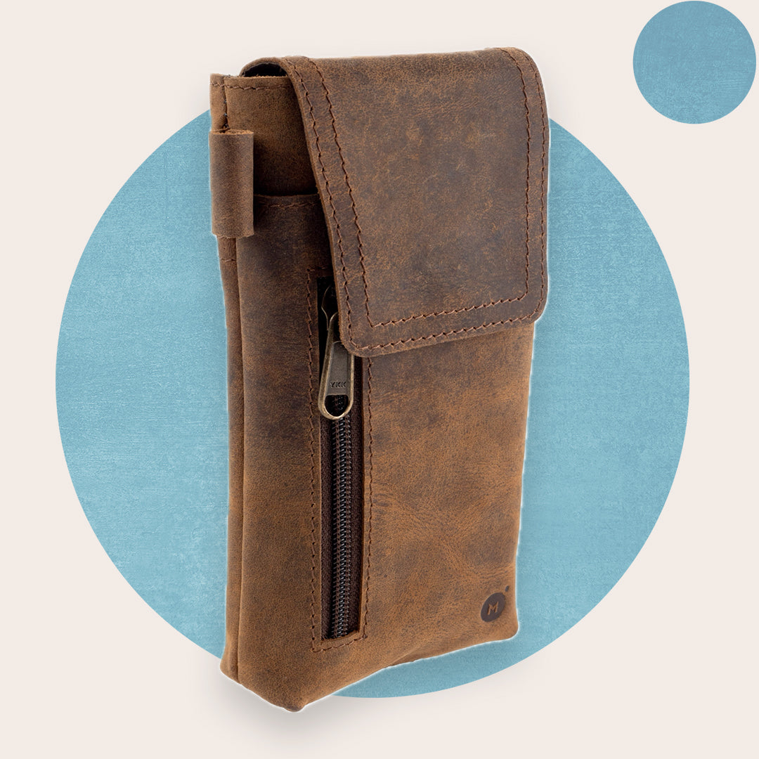 A brown leather phone holster with a zipper.