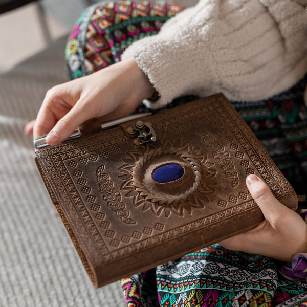 Woman holding a Refillable Leather Journal with Blue Stone